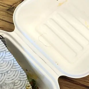 the inside of a plastic container with food in it