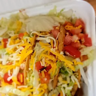 a close up of a taco in a styrofoam container