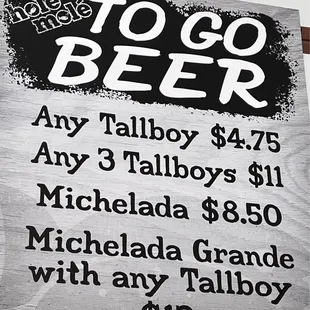 a sign for a to go beer