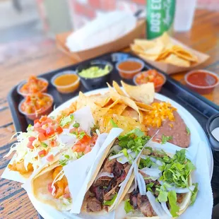 Surf &amp; Turf Taco Plate....2 Baja fish tacos and 2 smoked beef brisket tacos.....with the fixins