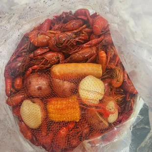 10 lbs of crawfish with potatoes, corn and a sausage link.