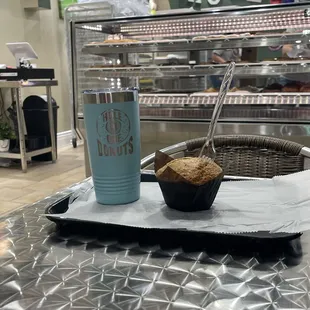 a cup of coffee and a muffin