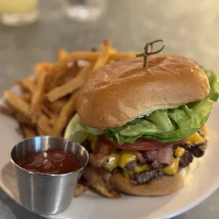 Cheese burger with added bacon, lettuce and tomatoes