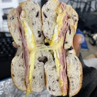 Ham, egg, and smoked gouda cheese on blueberry bagel