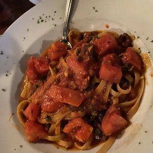 Putanesca on fettucini (Black olives, capers, garlic, onion and a hint of anchovy in a red sauce)