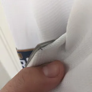 The thread is far enough into the patch that the edges flair up and have already caught on the fabric of the sleeves when putting them on.