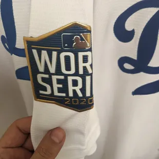 Someone left their give a damn at home and pressed the sleeve straight down the arm, bending the patch in half and fusing it to the fabric.