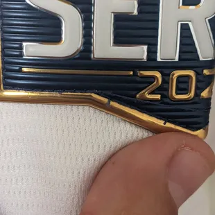 See the patches stitching? Notice all the loose threads and some that jump halfway across the patch before being randomly stitched back in.