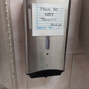 So this is in the bathroom and the sign simply means it is automatic and uses a sensor. The wording threw me off at first.