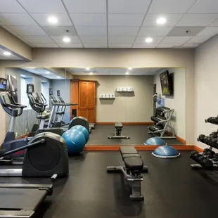 Our 24 hour fitness center features free weights, yoga mats, exercise orbs, treadmills, and stair climbers.