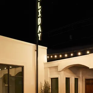 the front of a hotel at night