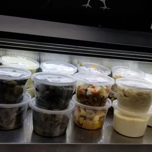 a variety of food in plastic containers