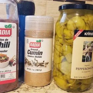 a jar of pickles and a jar of chili