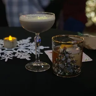 a drink and a candle on a table