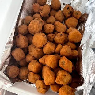 a container of fried chicken nuggies