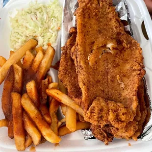 fried fish and french fries in a styrofoam container