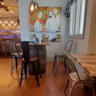 a dining room with a table and chairs