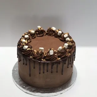 a chocolate cake with marshmallows on top