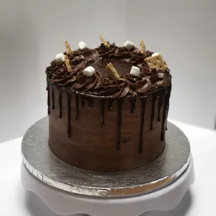 a chocolate cake with marshmallows on top