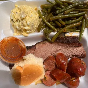 2 meats + 2 sides. Brisket and jalepeno cheddar sausage with green beans and potato salad