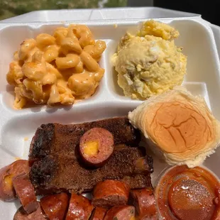 2 meats with 2 sides. Pork ribs and jalepeno cheddar sausage with potato salad and Mac n cheese