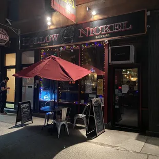 Outside w/ seating area for drinking and eating.