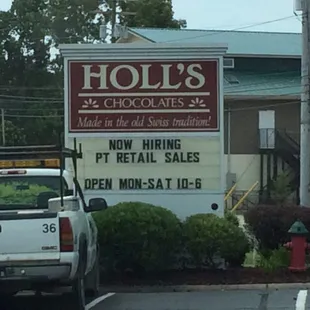 a truck parked in front of a store