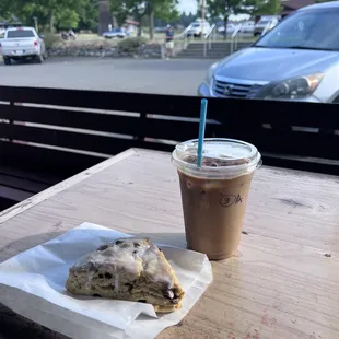 a coffee and a pastry on a table