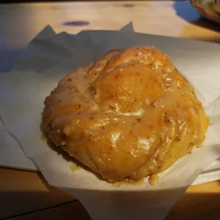 a pastry in a paper wrapper