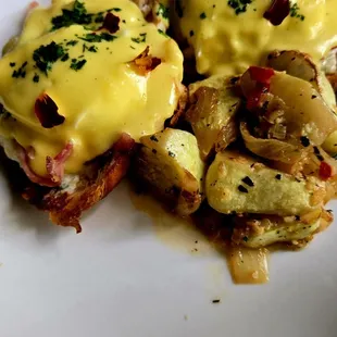 Eggs Benedict on Croissant with sautéed Squash.  Chefs Kiss!