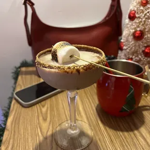 a glass of hot chocolate with marshmallows