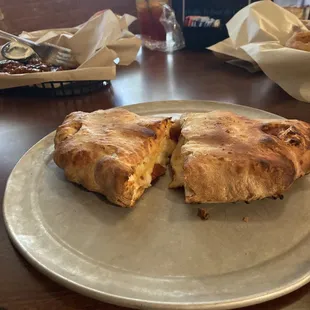 a half eaten pizza on a plate