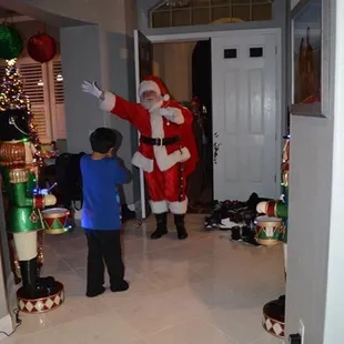 My son opened the door and got the surprise of his life! This moment was everything! The best Santa ever!