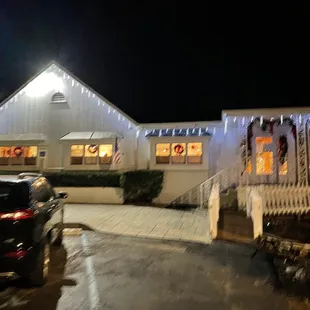 the front of a house decorated for christmas