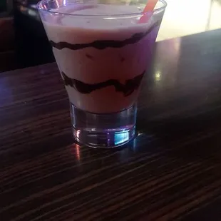 a shot of a drink on a bar