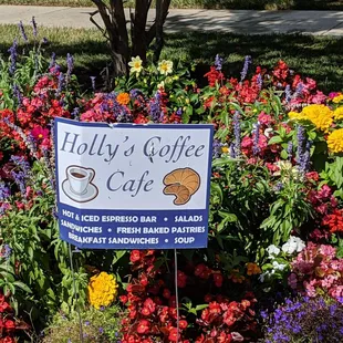 a sign for holly&apos;s coffee cafe