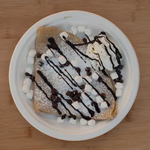  plate of crepes with chocolate and marshmallows