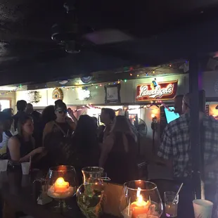 a crowd of people at a bar