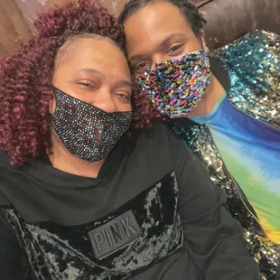 a man and a woman wearing face masks
