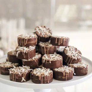 A coconut caramel &quot;Holly-O&quot; covered in milk chocolate and topped with toasted coconut.