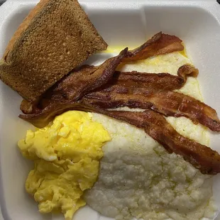 Buttery grits, wheat toast, 2 scrambled eggs and bacon ..,Good Morning!