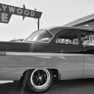 a black and white photo of a classic car