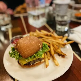 a hamburger and fries on a plate