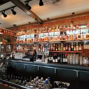 a woman standing at the bar