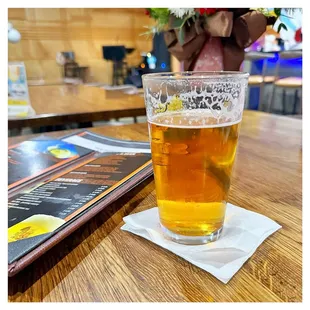 a glass of beer on a table