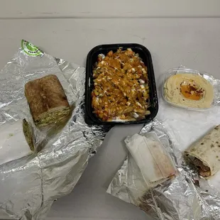 Chicken pesto, kebab wrap, loaded fries, humus