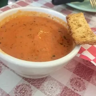 The best tomato basil soup I&apos;ve had in my life. Served with a basket of garlic crouton breadsticks.