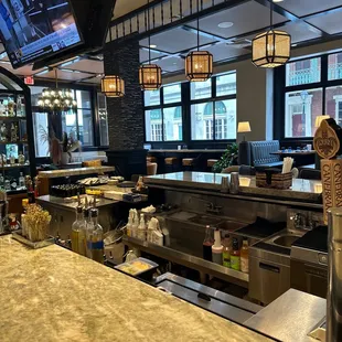 a restaurant with a bar and a television