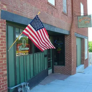 the american flag outside the door
