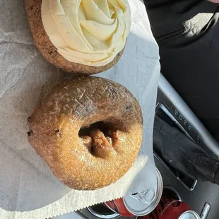 Blueberry cake donuts, one with cream cheese icing